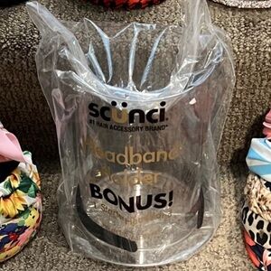 Scunci headband holder with space in the middle for scrunchies or brushes